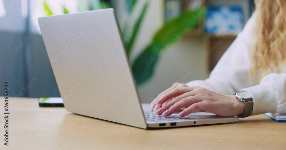 Female hands of business woman professional user worker using typing on laptop notebook keyboard sitting at home office desk working online with pc software apps technology concept, close up side view Female hands of business woman professional user worker using typing on laptop notebook keyboard sitting at home office desk working online with pc software apps technology concept, close up side view