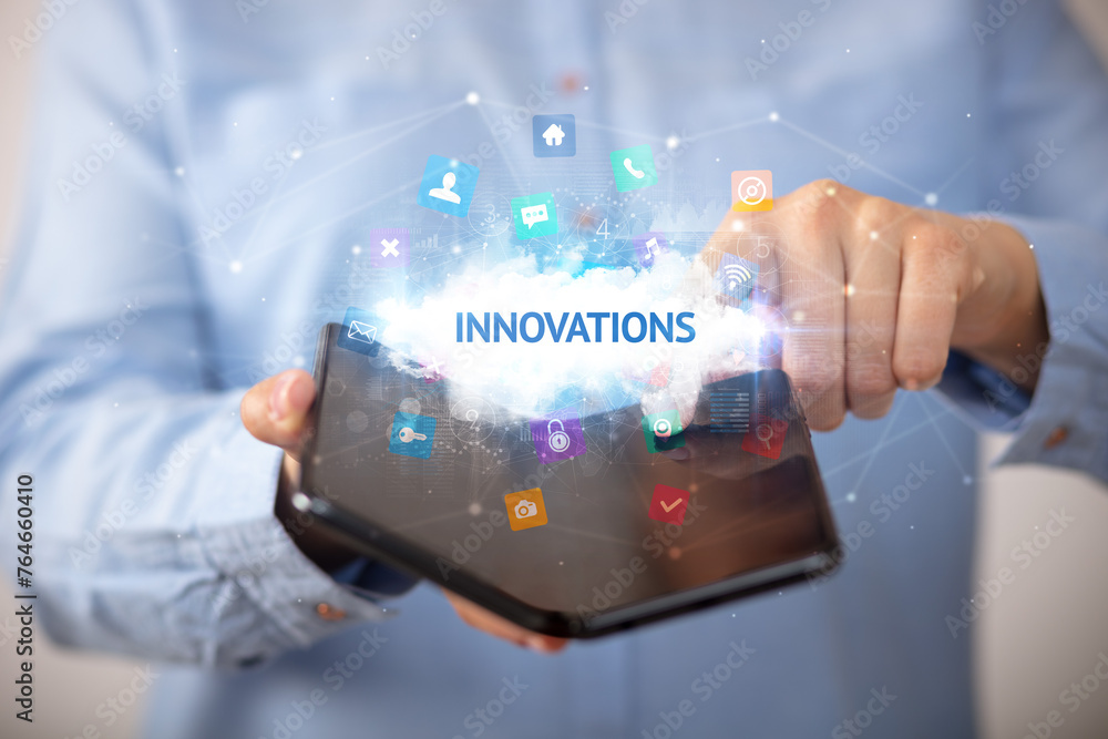 Businessman holding a foldable smartphone, technology concept Businessman holding a foldable smartphone, technology concept
