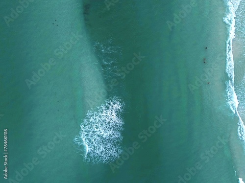 Aerial view of turquoise sea with waves