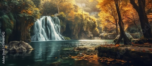 Colorful majestic waterfall in national park forest photo