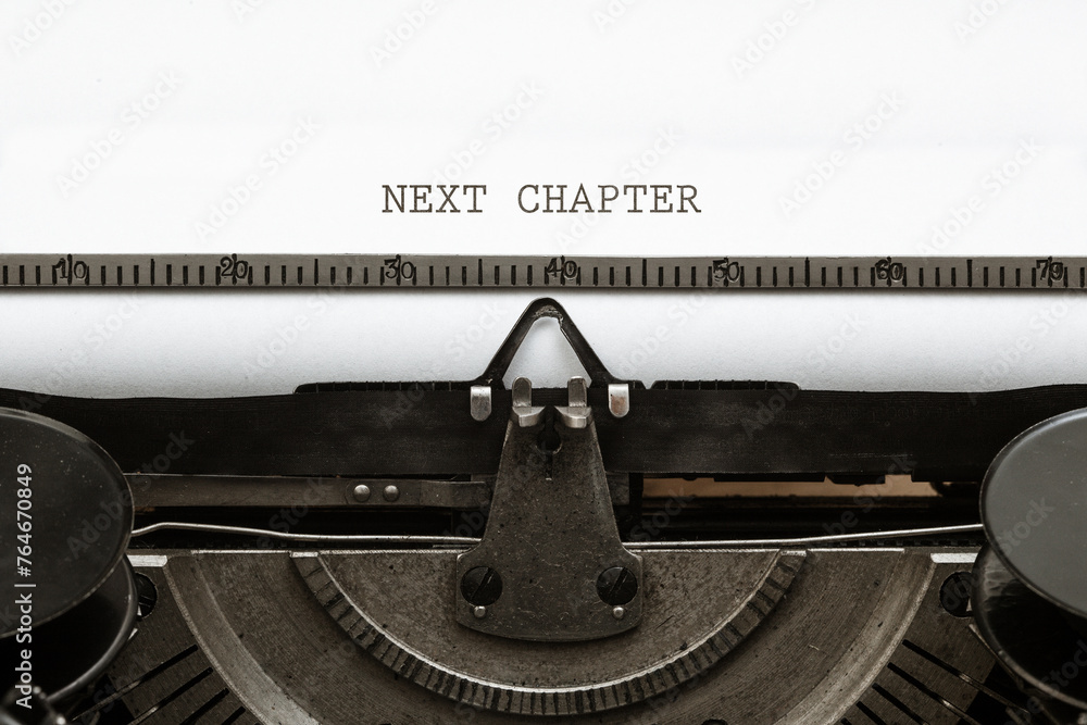 Next Chapter headline written on vintage type writer from 1920s