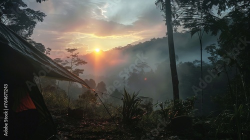 Smoke from breakfast at Sunrise in Base Camp in Indonesian Jungle - Gunung Leuser National Park. photo