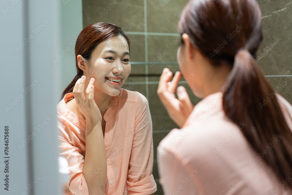 Photo of young Asian woman in bathroom Photo of young Asian woman in bathroom