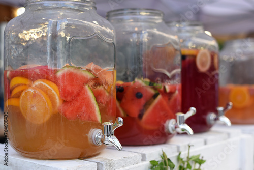 Orange and raspberry lemonade in glass bowls © Viktoriia Pletska