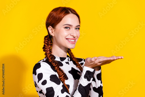 Photo of pretty adorable lady dressed cowskin top showing arms empty space isolated yellow color background
