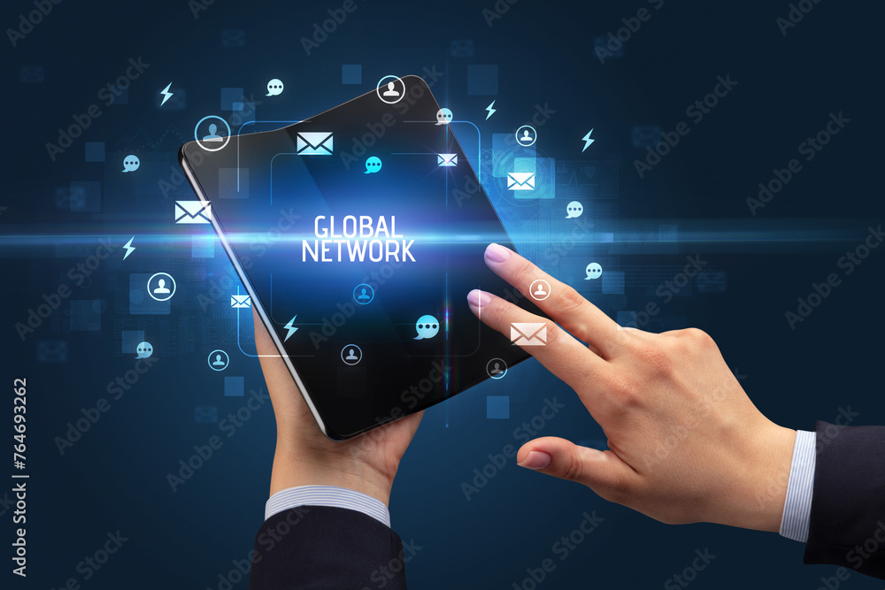 Businessman holding a foldable smartphone, social media concept Businessman holding a foldable smartphone, social media concept