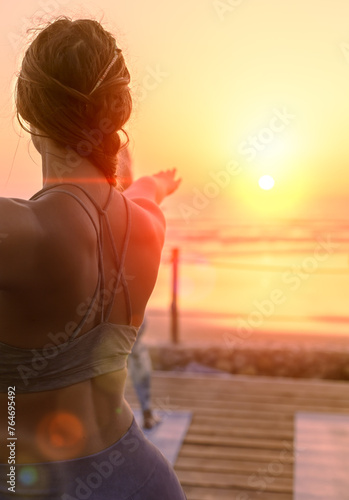 Yogi at sunset in tamraght beach, with flare photo