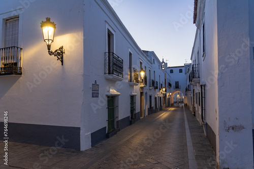 Streets of the beautiful village of Olivenza with its white typical houses at night. Badajoz, Extremadura, Spain photo