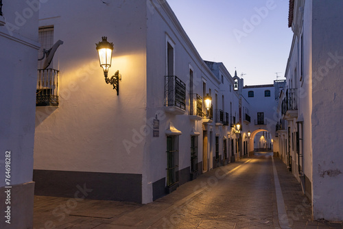 Streets of the beautiful village of Olivenza with its white typical houses at night. Badajoz, Extremadura, Spain photo