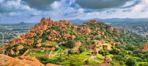 Chitradurga fort ruins and cityscape on a cloudy morning