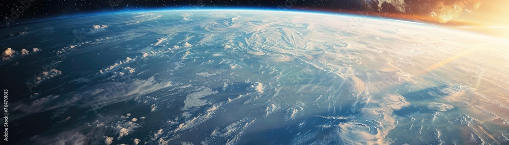 A breathtaking view of Earth's horizon as the sun emerges, casting a radiant glow over the planet's surface.
A breathtaking view of Earth's horizon as the sun emerges, casting a radiant glow over the planet's surface.