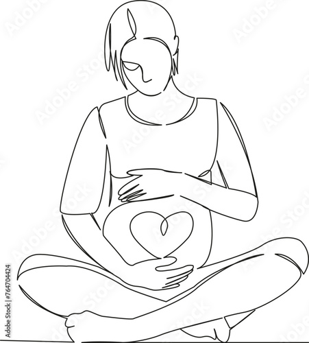 pregnant woman in lotus with heart