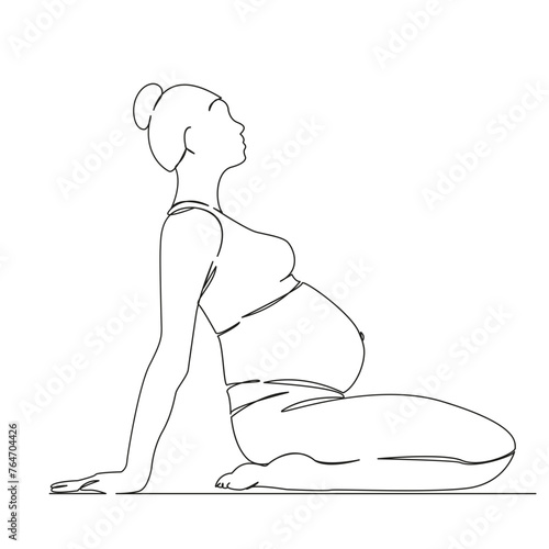 pregnant woman doing yoga and gymnastics
