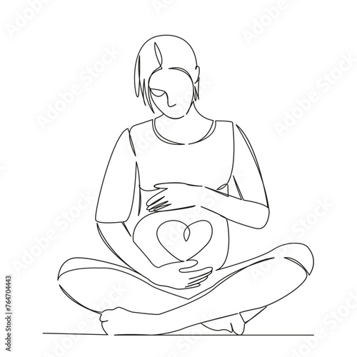 pregnant woman in lotus with heart