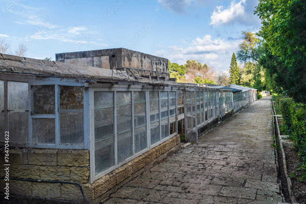 San Anton Gardens, Attard, Malta - March 11th 2022: Greenhouses in the grounds of San Anton Palace, the summer residence for the Grand Masters of Malta and has been a public garden since 1882.