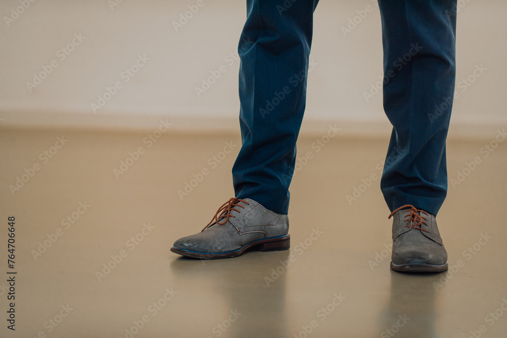 Start Concept. Low Section of Businessman Steps into Start Line and Moving Forward to New Challenge. Cropped Image. Side View. Business Strategy, Metaphor Conceptual for Restart Start Concept. Low Section of Businessman Steps into Start Line and Moving Forward to New Challenge. Cropped Image. Side View. Business Strategy, Metaphor Conceptual for Restart