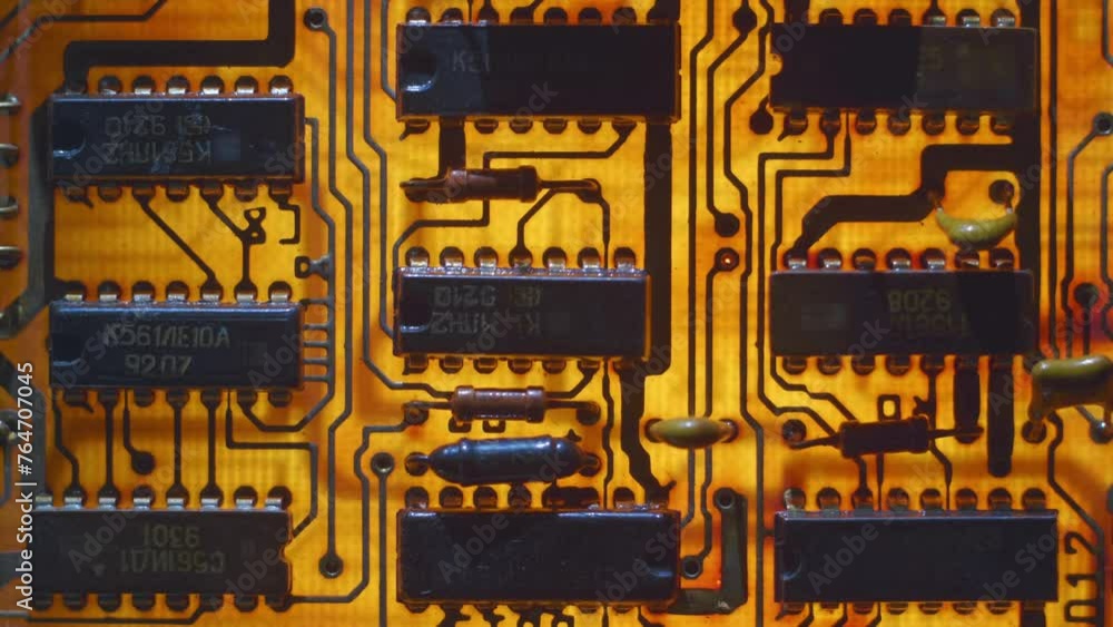 Vidéo Stock A printed circuit board with rows of microchips and other ...