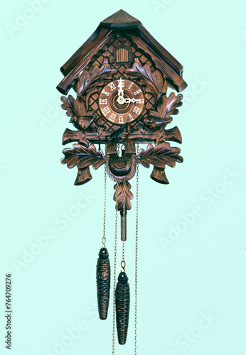 Old cuckoo clock on isolated background.  © Loren Biser