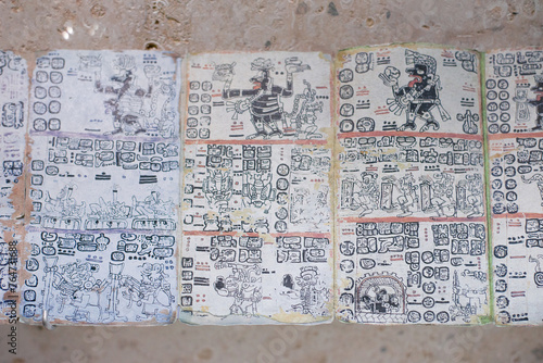 Mayan writing manuscript on square sheets of paper forming a whole story