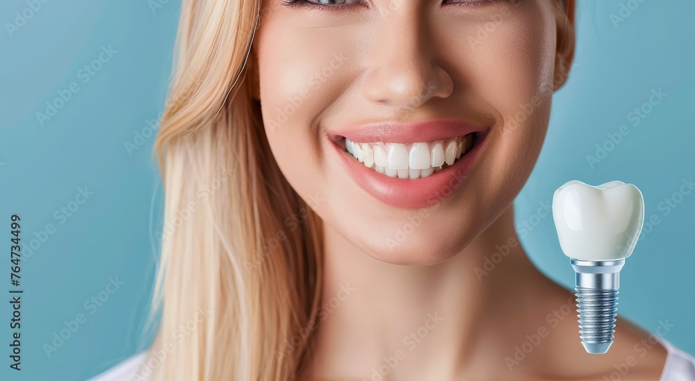 A happy young woman with a bright white smile and a dental implant after a denture prosthesis operation. Dental surgery at a medical clinic or dentist. A happy young woman with a bright white smile and a dental implant after a denture prosthesis operation. Dental surgery at a medical clinic or dentist.