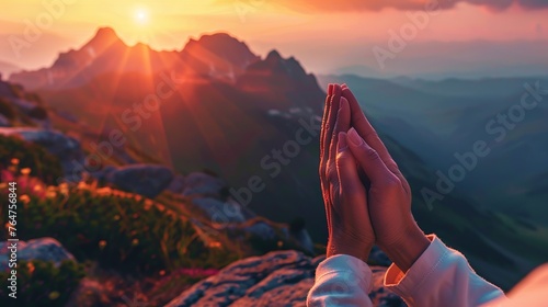 human hands praying to god for worship with mountains background © akhmad