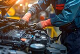 Mechanics hands working on car battery maintenance in an auto repair service checking the electrical system. Concept Auto Repair Service, Mechanics, Car Battery Maintenance, Electrical System