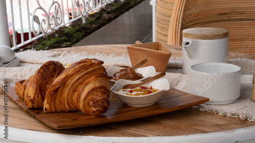 Austrian-style croissant together with Austrian butter and marmalade. Breakfast table with high nutritions vegan and vegetable food (ID: 764767067)