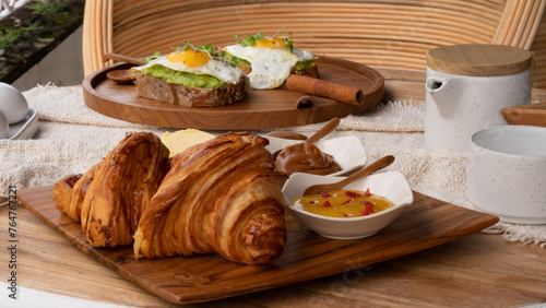 Austrian-style croissant together with Austrian butter and marmalade. Breakfast table with high nutritions vegan and vegetable food (ID: 764767221)