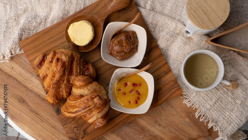 Austrian-style croissant together with Austrian butter and marmalade. Breakfast table with high nutritions vegan and vegetable food (ID: 764767614)