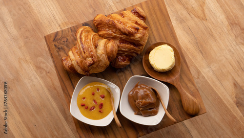 Austrian-style croissant together with Austrian butter and marmalade. Breakfast table with high nutritions vegan and vegetable food (ID: 764768099)