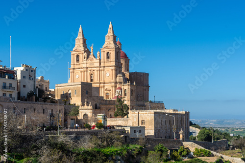 Mellieha, Malta - December 25th 2022: The Parish Church of the Nativity of the Virgin Mary was built between 1881 and 1898, and the dome and bell towers were completed between 1920 and 1940.
