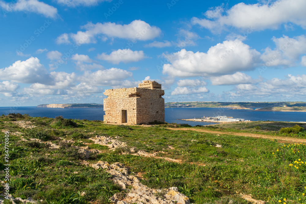 Marfa Ridge, Mellieha, Malta - January 8th 2023: World War 2 era British army Pillbox on Marfa Ridge overlooking the Gozo Channel, Cirkewwa  ferry terminal and Gozo and Comino Islands.