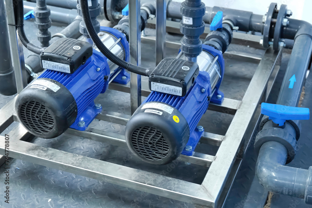 Pumps with induction motors on pipeline.