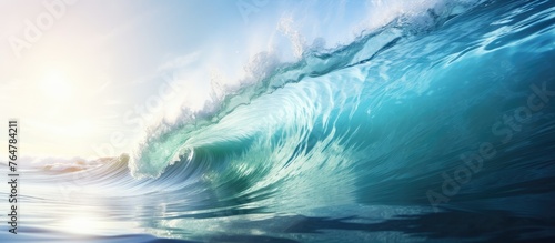 A single wave gently rolling in the ocean under a bright and clear blue sky, reflecting a peaceful and serene atmosphere