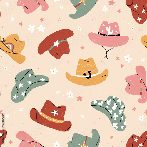 Lovely illustrated cowboy hats with different ornaments, cactus, horseshoe, stars. Vector hand drawn illustration, seamless pattern, great for textiles, wallpapers, wrapping. © TALVA
