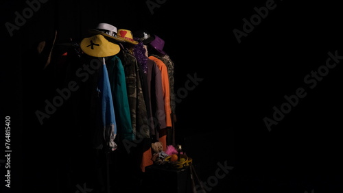 theatre costumes on hangers. stage costumes under the spotlight.