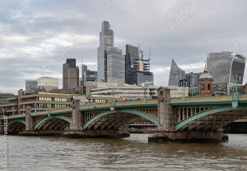Beautiful view of Skyscrapers and Southwark bridge in the business district over River thames in city of london. Architectural modern buildings, Space for text, Selective Focus.