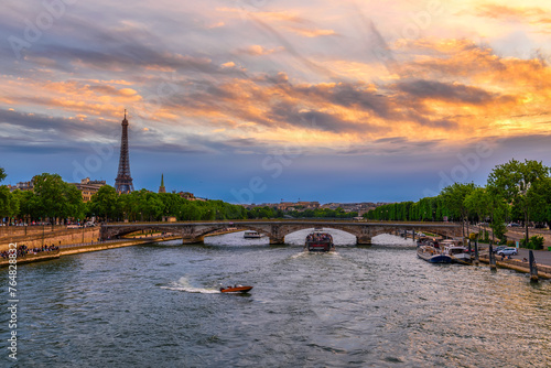 Sunset view of Eiffel tower and Seine river in Paris, France. Eiffel Tower is one of the most iconic landmarks of Paris. Cityscape of Paris