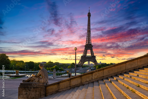 Sunrise view of Eiffel Tower from Jardins du Trocadero in Paris, France. Eiffel Tower is one of the most iconic landmarks of Paris