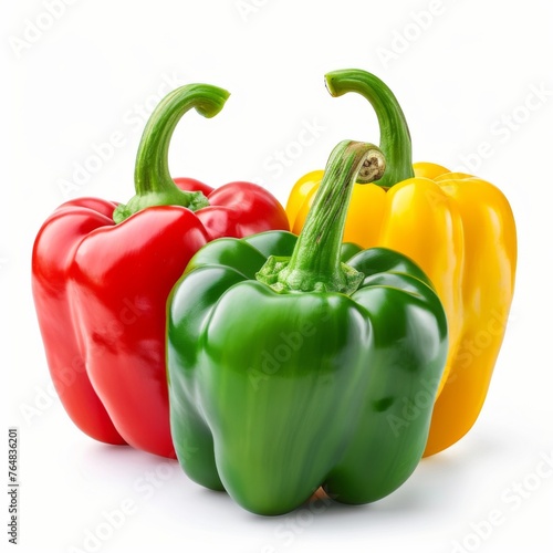 Red, green and yellow bell peppers isolated on white background