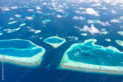 Fotografie Aerial view of Atolls in Maldives archipelago in the Indian Ocean