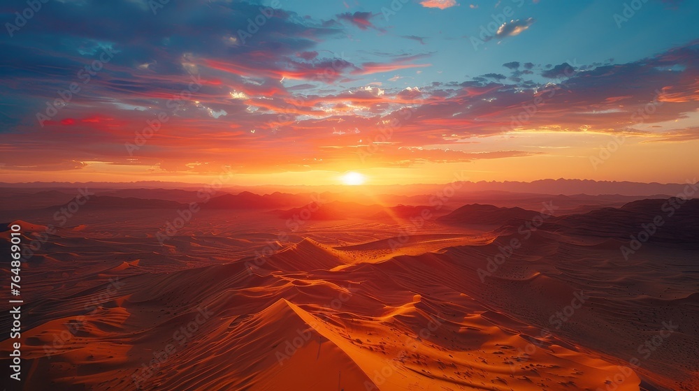 The environment: A breathtaking sunset over a vast desert landscape