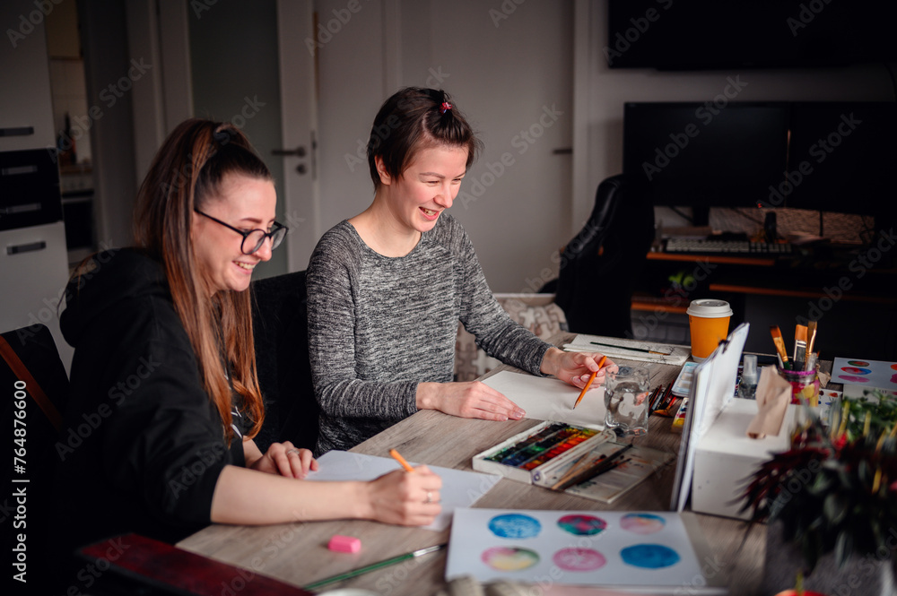 A heartwarming scene of two friends laughing and enjoying their artistic hobbies together at a cluttered and lively workspace