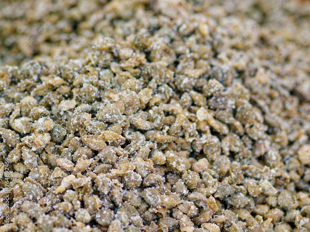 background of many small green sicilian capers typical of Mediterranean countries in a market background of many small green sicilian capers typical of Mediterranean countries in a market