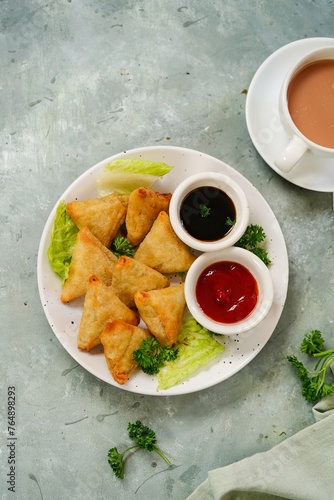 Homemade mini cocktail samosa | Indian appetizer served with ketchup and tamarind sauce