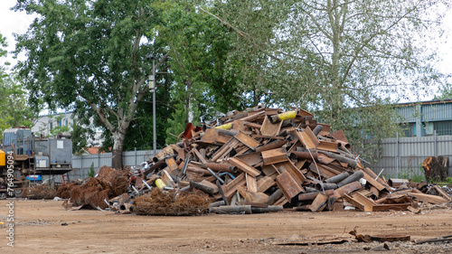 Big Pile of Rusty Iron Metal in Scrap Yard Recycling Facility