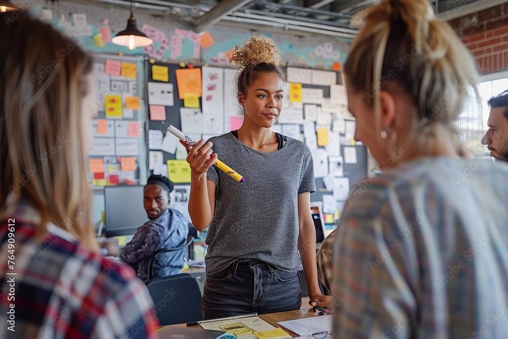 Obraz premium A charismatic business leader is hosting an interactive brainstorming session in a vibrant creative office, with colorful sticky notes and innovative ideas on display.