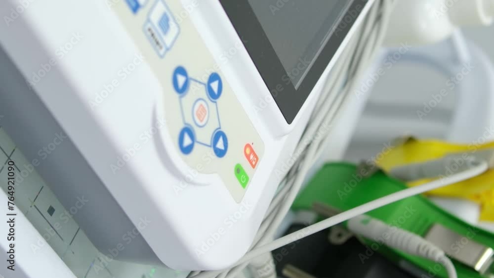 Heart cardiogram in the hands of a doctor close-up. Cardiologist is studying the testimony of an electrocardiograph. Heart cardiogram in the hands of a doctor close-up. Cardiologist is studying the testimony of an electrocardiograph.