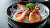 Red shrimps in a black plate bowl with ice and parsley on a black table in a luxury restaurant. Shrimp day. Copy space