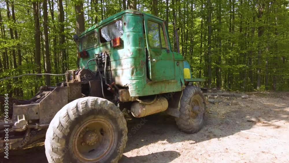 a unique, still Soviet USSR machine, very ancient and assembled from antique parts, works as an all-terrain vehicle at a logging site in the spring in a beech forest, Ukraine, Carpathians a unique, still Soviet USSR machine, very ancient and assembled from antique parts, works as an all-terrain vehicle at a logging site in the spring in a beech forest, Ukraine, Carpathians